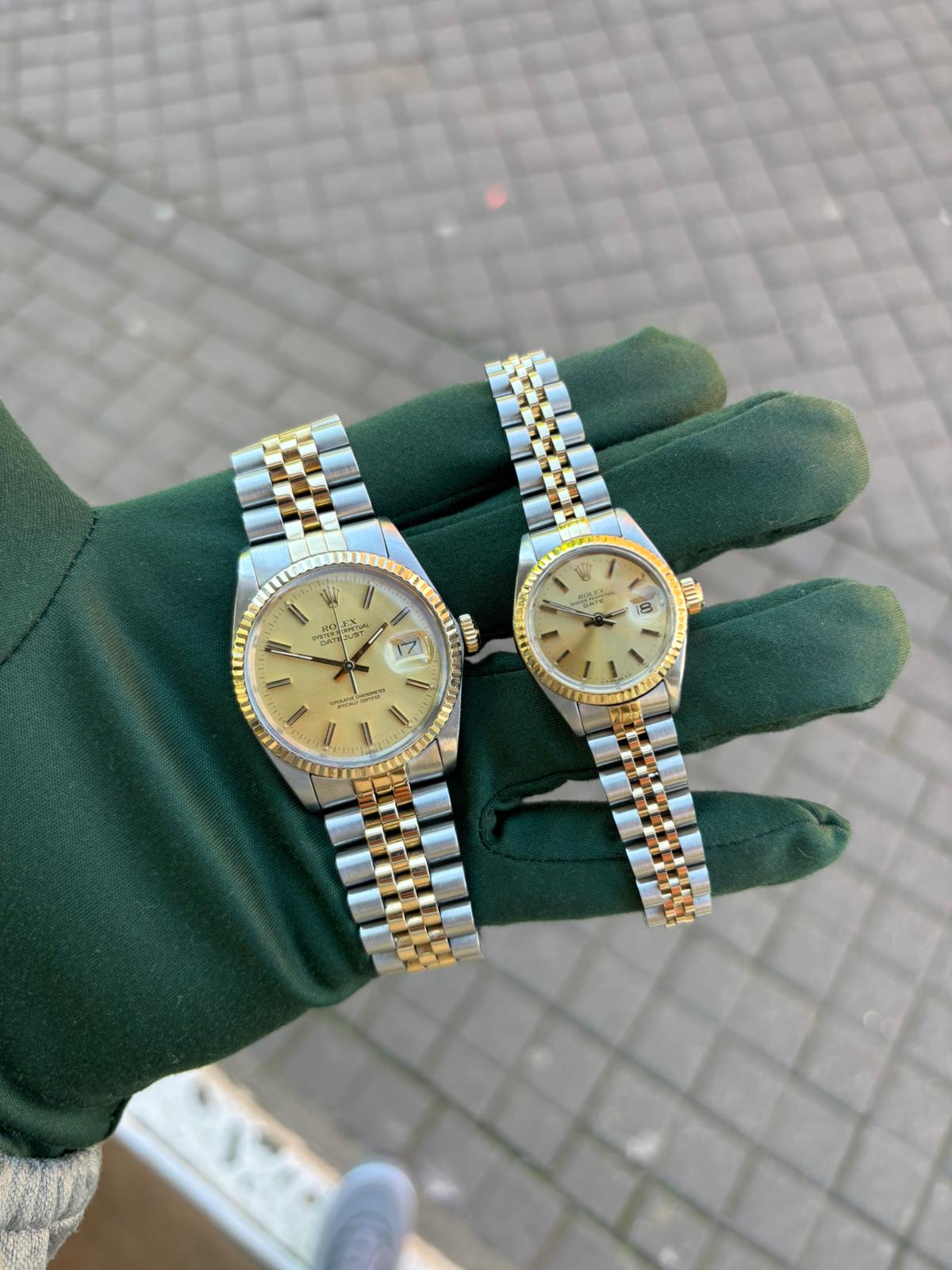 Pair of Rolex Datejusts in hand