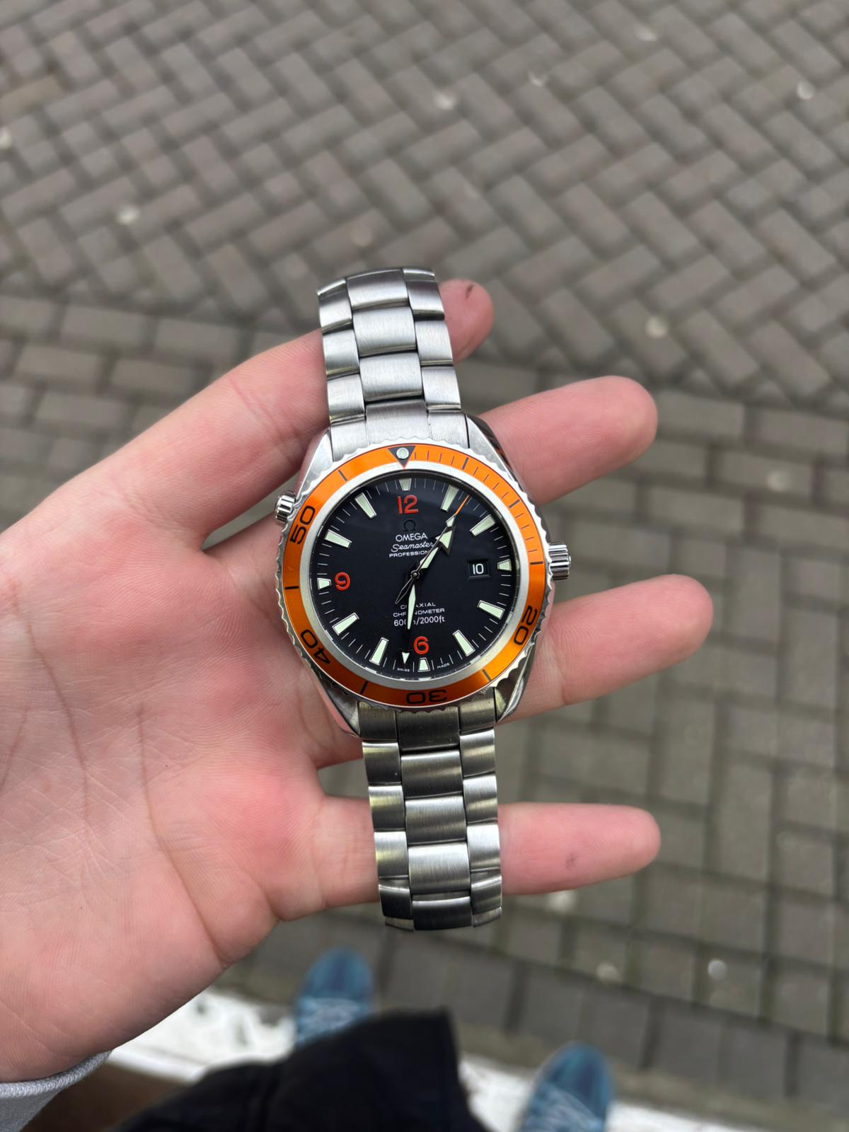 Omega Speedmaster chronograph in hand